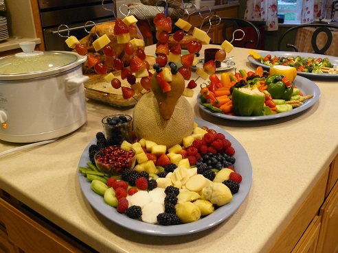 Thanksgiving Food Tips from Holidays and Observances - pictured is a Fruit Turkey Tray and a Veggie Turkey Tray